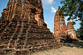 Ayutthaya, Thailand. Wat Mahathat, three auxiliary prang lined West East along the south enclosure wall of the main prang.